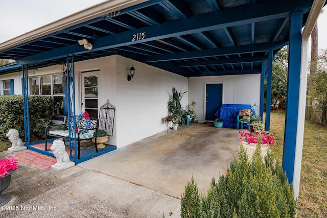 view of patio featuring a carport