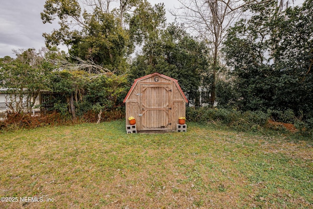 view of outbuilding featuring a lawn