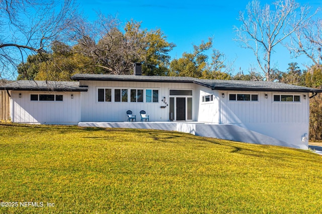 ranch-style home with a front yard