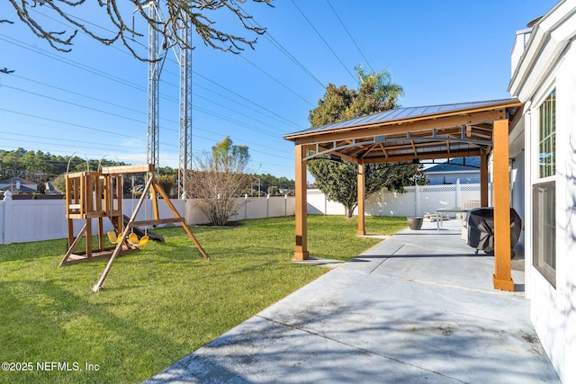 view of yard with a gazebo, a patio area, and a playground