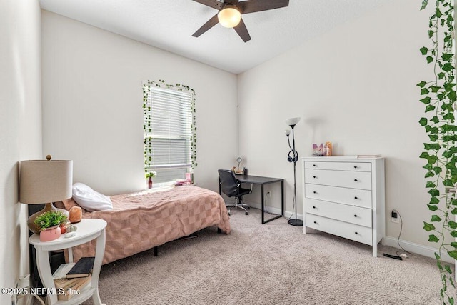 bedroom featuring light carpet and ceiling fan