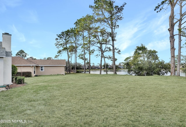 view of yard with a water view