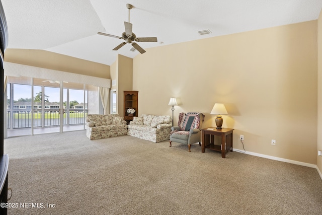 sitting room with high vaulted ceiling, carpet floors, and ceiling fan