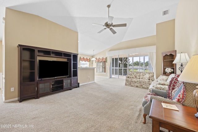 carpeted living room with high vaulted ceiling and ceiling fan