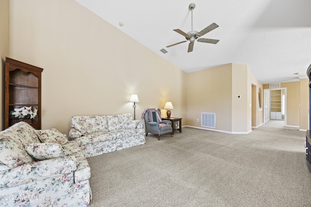 carpeted living room with high vaulted ceiling and ceiling fan