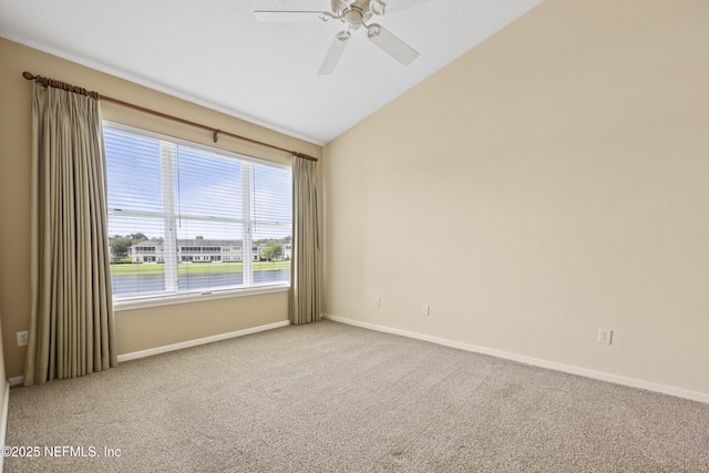 unfurnished room with vaulted ceiling, light carpet, a textured ceiling, and ceiling fan