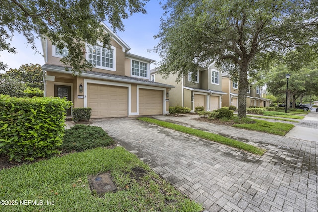 view of front of property with a garage