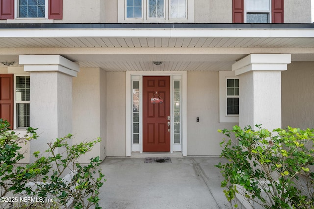 doorway to property with covered porch