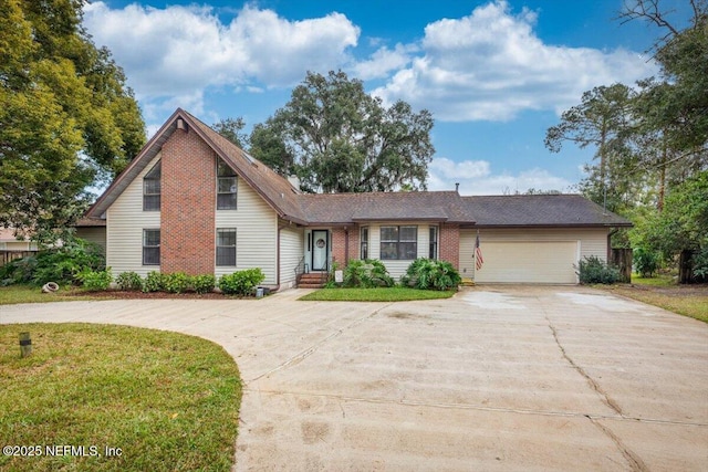 view of front of property featuring a garage and a front yard