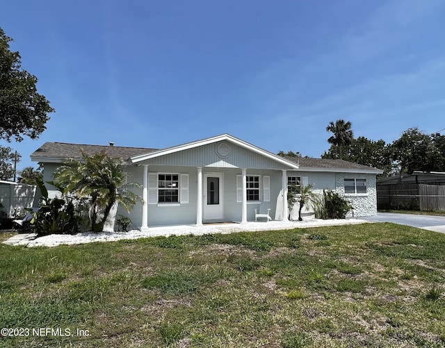 view of front facade with a porch and a front yard