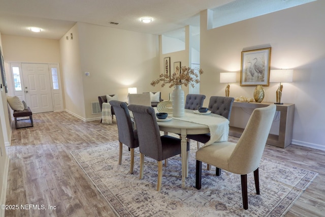 dining area with light hardwood / wood-style floors