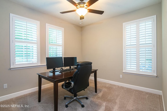 carpeted home office with ceiling fan