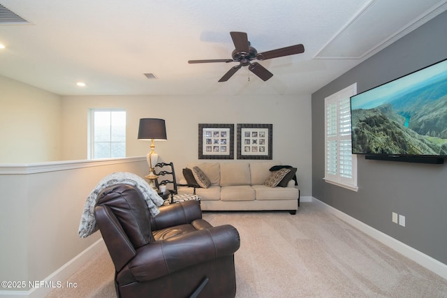 carpeted living room with a healthy amount of sunlight