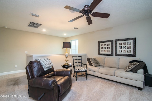 living room with light colored carpet and ceiling fan