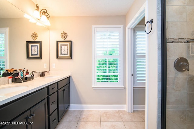 bathroom with vanity, tile patterned floors, and a chandelier