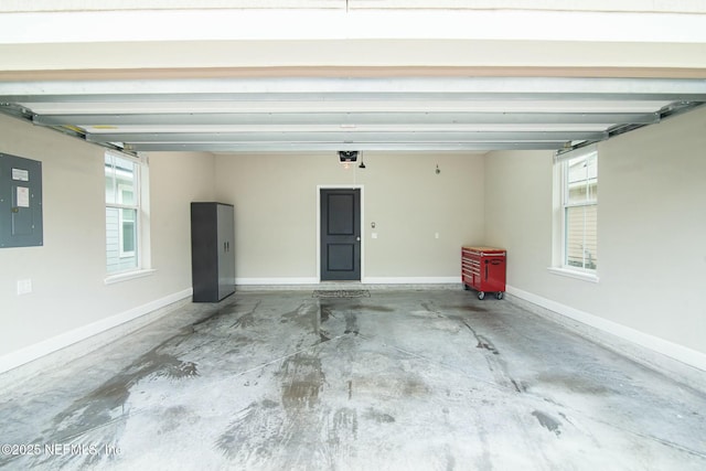 garage featuring a garage door opener and electric panel