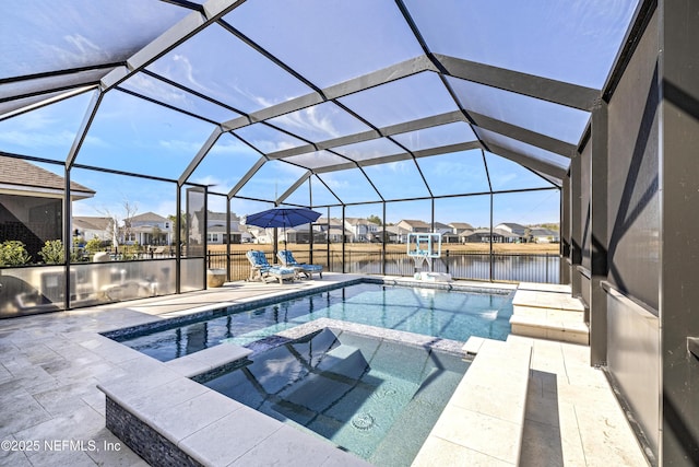 view of swimming pool with an in ground hot tub, a water view, a lanai, and a patio area