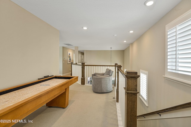 game room with light colored carpet