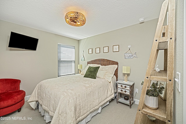 bedroom with carpet flooring and a textured ceiling