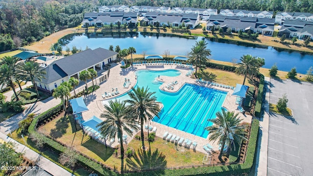 birds eye view of property with a water view