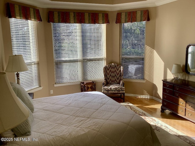 bedroom featuring ornamental molding and baseboards