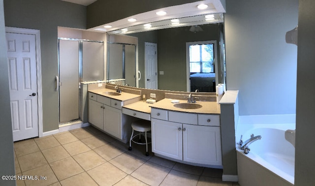 full bath featuring a garden tub, a stall shower, connected bathroom, vanity, and tile patterned flooring