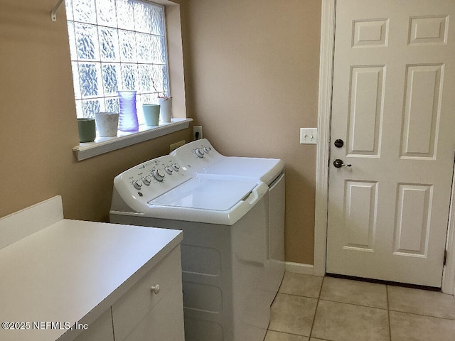 clothes washing area with cabinet space, independent washer and dryer, and light tile patterned flooring