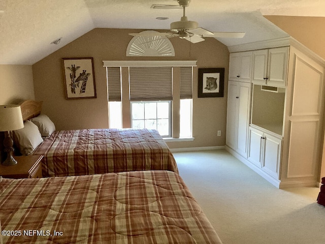 unfurnished bedroom with lofted ceiling, light carpet, and ceiling fan