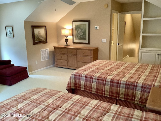 bedroom with lofted ceiling, baseboards, visible vents, and light colored carpet