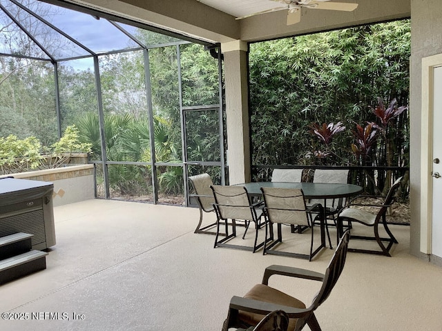 sunroom featuring a ceiling fan