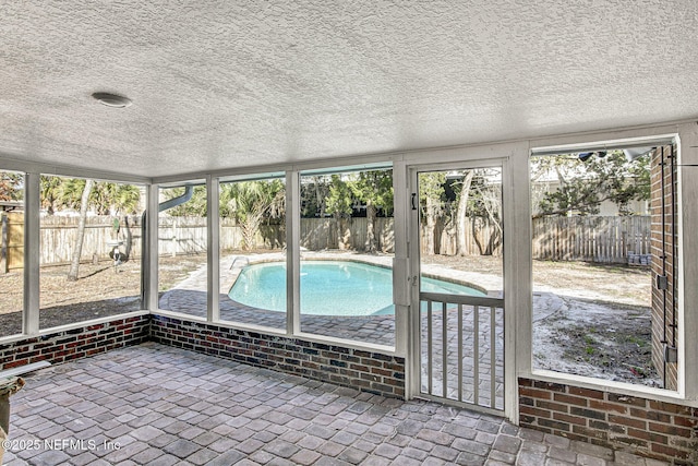 unfurnished sunroom featuring a healthy amount of sunlight