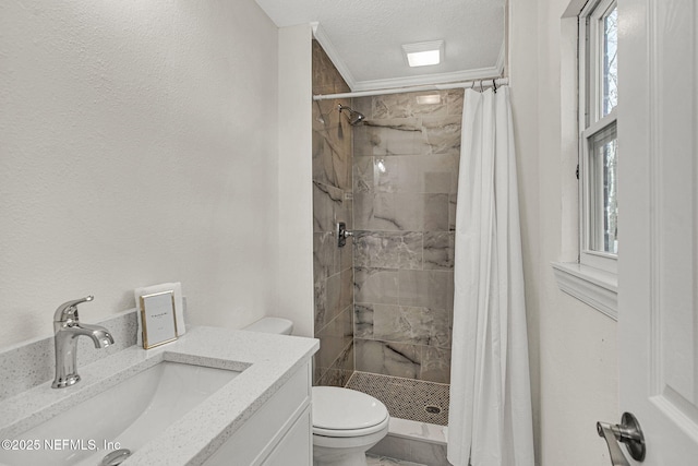 bathroom with vanity, ornamental molding, a textured ceiling, curtained shower, and toilet