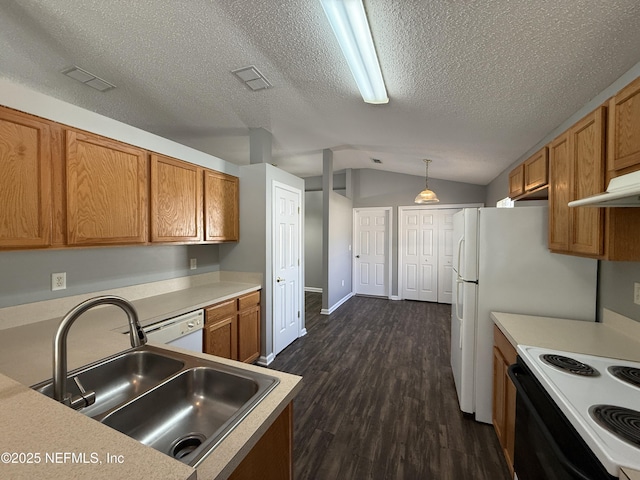 kitchen with lofted ceiling, sink, hanging light fixtures, dark hardwood / wood-style floors, and built in desk