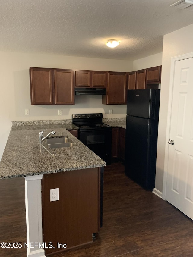 kitchen featuring sink, dark hardwood / wood-style floors, light stone counters, black appliances, and kitchen peninsula