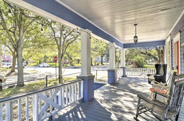 wooden terrace featuring a porch