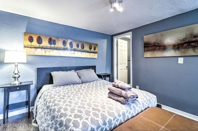 bedroom featuring a textured ceiling