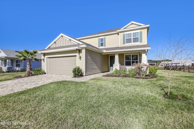 85248 Berryessa Way, Fernandina Beach, FL 32034 - craftsman-style house with a garage, covered porch, and a front yard
