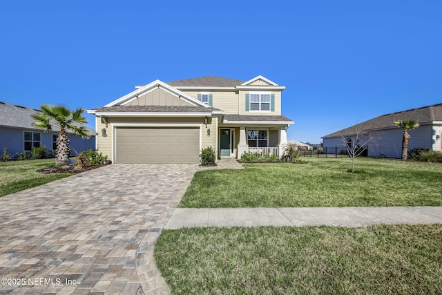 85248 Berryessa Way, Fernandina Beach, FL 32034 - view of front of property with a porch, a garage, and a front yard