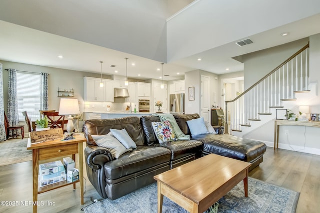 85248 Berryessa Way, Fernandina Beach, FL 32034 - living room with a high ceiling and light wood-type flooring