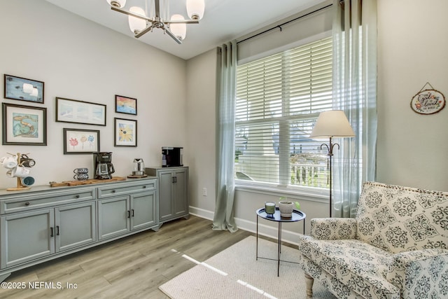 85248 Berryessa Way, Fernandina Beach, FL 32034 - living area with an inviting chandelier and light hardwood / wood-style flooring
