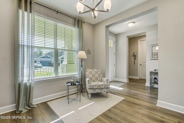 85248 Berryessa Way, Fernandina Beach, FL 32034 - living area with hardwood / wood-style flooring and an inviting chandelier