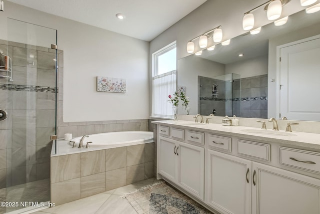 85248 Berryessa Way, Fernandina Beach, FL 32034 - bathroom with tile patterned floors, vanity, and independent shower and bath