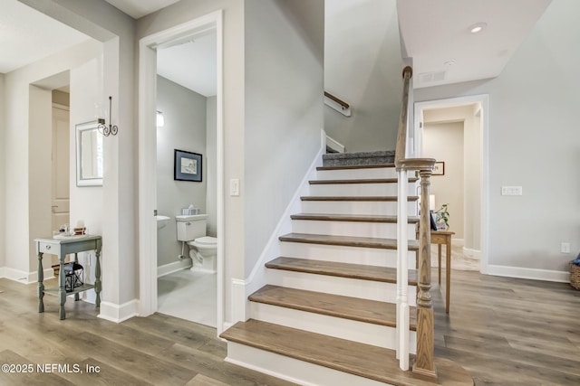 85248 Berryessa Way, Fernandina Beach, FL 32034 - staircase featuring hardwood / wood-style flooring