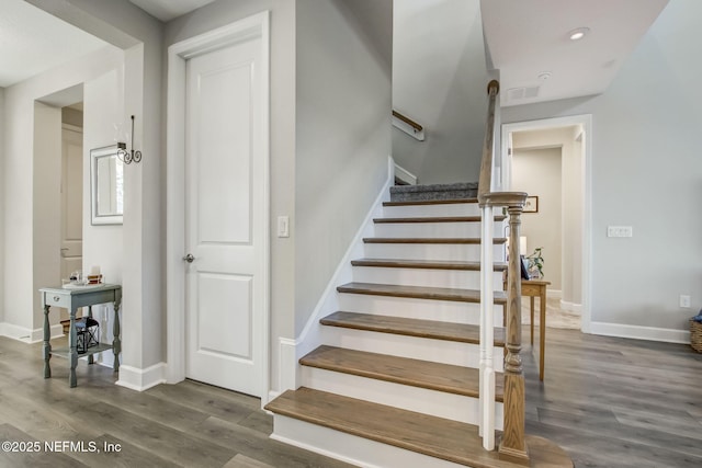 85248 Berryessa Way, Fernandina Beach, FL 32034 - stairs featuring hardwood / wood-style flooring