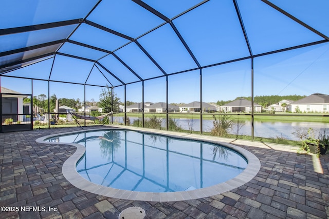 85248 Berryessa Way, Fernandina Beach, FL 32034 - view of pool featuring a patio area, a water view, and glass enclosure