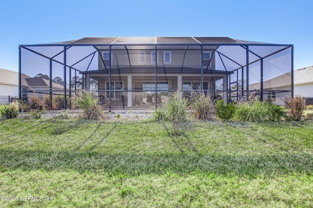 85248 Berryessa Way, Fernandina Beach, FL 32034 - rear view of house featuring a yard and glass enclosure