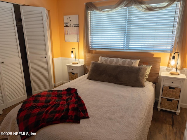 bedroom with hardwood / wood-style flooring and a closet