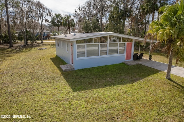 view of property exterior with a yard