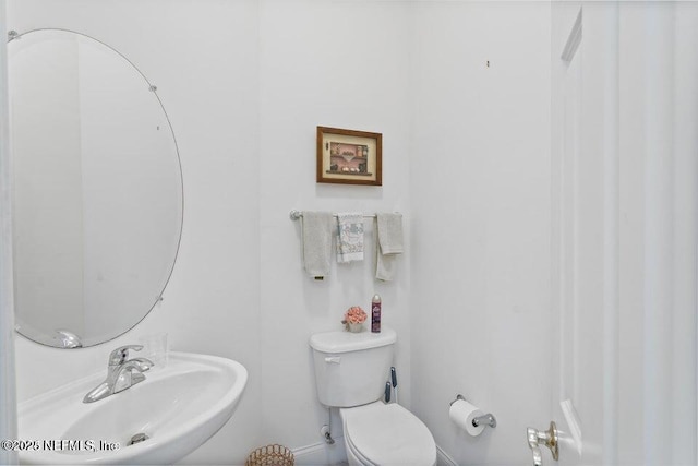 bathroom featuring sink and toilet