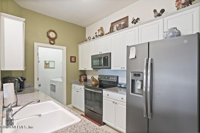 kitchen with white cabinetry, sink, and stainless steel appliances